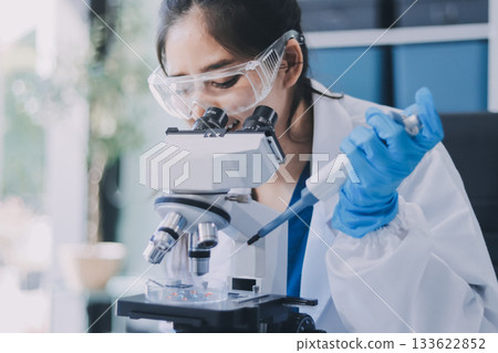 Portrait, science and happy woman on laptop in lab to research chemistry, test or innovation. Microscope, scientist and face of medical doctor in goggles for microbiology, healthcare or pharma study Portrait, science and happy woman on laptop in lab to research chemistry, test or innovation. Microscope, scientist and face of medical doctor in goggles for microbiology, healthcare or pharma study 133622852