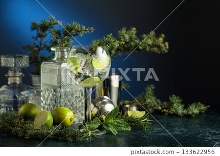 Cocktail gin and tonic with ice and lime slices. Cocktail gin and tonic with ice and lime slices. 133622956