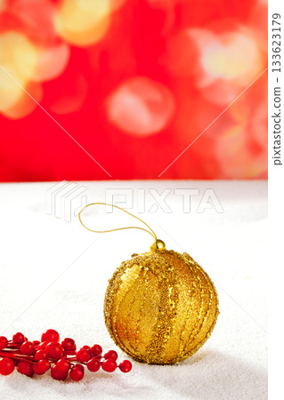 Christmas card of golden bauble berries on snow Christmas card of golden bauble berries on snow 133623179