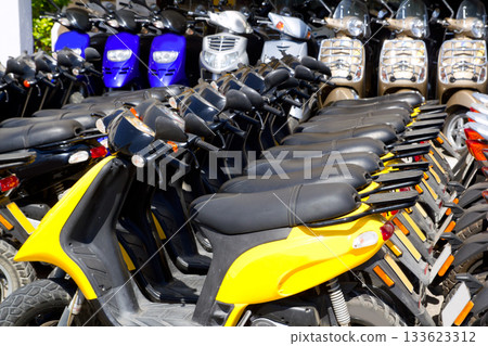 scooter bikes in rental shop in a row scooter bikes in rental shop in a row 133623312