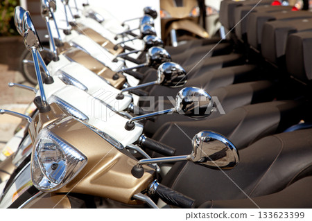 bikes scooter motoerbikes detail in a row bikes scooter motoerbikes detail in a row 133623399