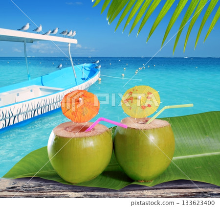 coconuts straw cocktails in tropical caribbean beach 133623400