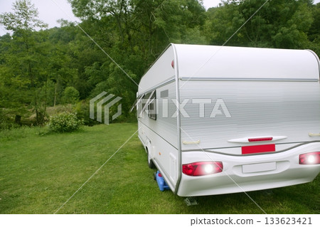 Caravan van in the green meadow camping Caravan van in the green meadow camping 133623421