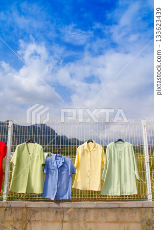 fashion outdoor market with clothes hanging fashion outdoor market with clothes hanging 133623439
