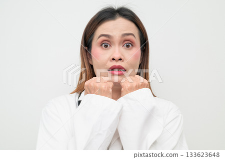 Scared Asian Healthcare Professional Doctor in White Coat Worried Studio Portrait Scared Asian Healthcare Professional Doctor in White Coat Worried Studio Portrait 133623648