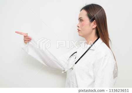 Profile View of Asian Healthcare Professional Doctor in White Coat Pointing Finger 133623651
