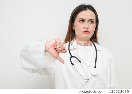 Asian Healthcare Professional Doctor in White Coat Thumbs Down 133623689