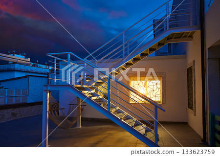 House window light glow in a thunder storm 133623759