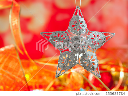 Christmas card of silver star and red blur Christmas card of silver star and red blur 133623784