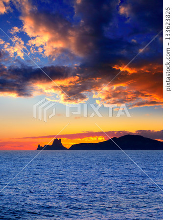Ibiza island sunset with Es Vedra in background Ibiza island sunset with Es Vedra in background 133623826