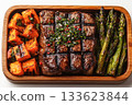 Diet specific box. Paleo lunch box. Featuring grilled steak, roasted sweet potatoes, and steamed asparagus. Packed in a wooden container. 133623844