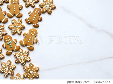 Gingerbread Men and Snowflake Cookies on White Marble Background 133623863
