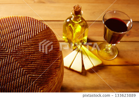 Manchego cheese from Spain in wooden table Manchego cheese from Spain in wooden table 133623889