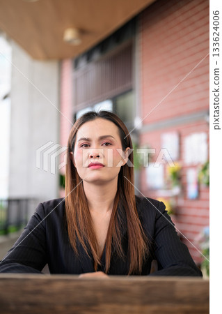 Thai Business Woman Outdoors in Professional Attire Thai Business Woman Outdoors in Professional Attire 133624006
