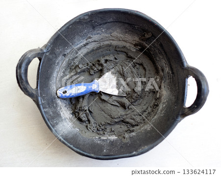 cement portland gray fresh mortar mix with spatula 133624117