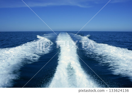 Boat white wake on the blue ocean sea 133624136
