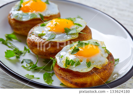 Tapas mushrooms with quail eggs from Spain 133624180