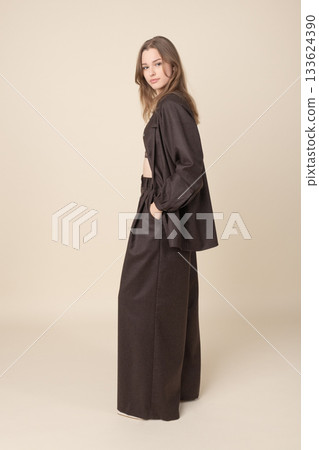 Beautiful woman with brown linen suit studio portrait 133624390