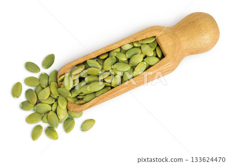 Peeled pumpkin seeds in wooden scoop isolated on white background. Top view. Flat lay Peeled pumpkin seeds in wooden scoop isolated on white background. Top view. Flat lay 133624470