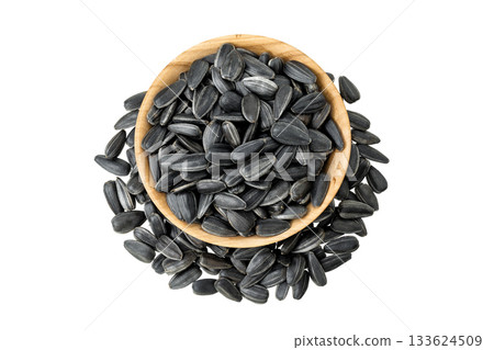 Sunflower seeds in wooden bowl isolated on white background. Top view. Flat lay 133624509
