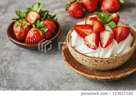 Fresh strawberries with whipped cream served in a rustic bowl Fresh strawberries with whipped cream served in a rustic bowl 133625580