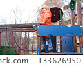 Young boy playing on urban playground in autumn 133626950
