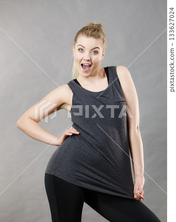 Happy woman wearing black tank top 133627024