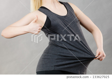 Woman wearing too big tshirt Woman wearing too big tshirt 133627025