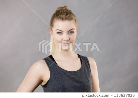 Happy woman wearing black tank top 133627026