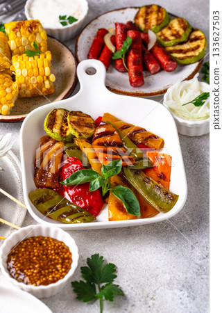 Assortment of grilled bbq meat and vegetables Assortment of grilled bbq meat and vegetables 133627503