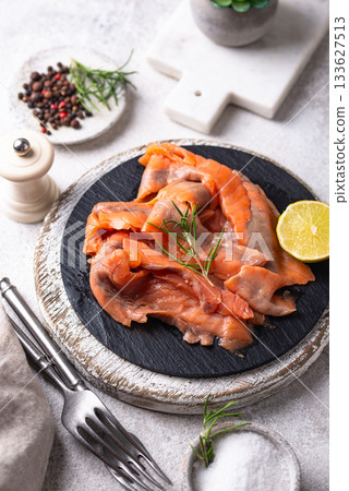 Salted sliced salmon fish with herbs Salted sliced salmon fish with herbs 133627513