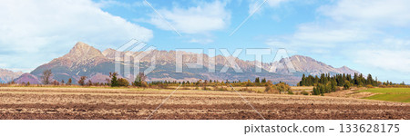 Mount Krivan peak (Slovak symbol) wide panorama with autumn dry field in foreground, Typical autumnal scenery of Liptov region, Slovakia Mount Krivan peak (Slovak symbol) wide panorama with autumn dry field in foreground, Typical autumnal scenery of Liptov region, Slovakia 133628175
