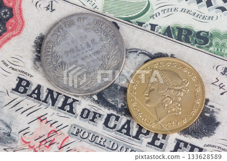 US banknotes and silver certificates with gold dollar coin 133628589