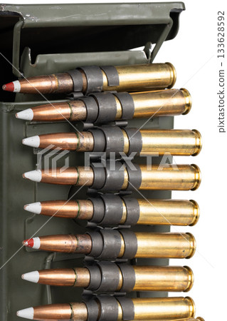 .50 BMG caliber machine gun ammunition belt with cartridges in ammunition can. 133628592