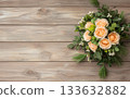 Peach rose bouquet wooden background green foliage white berries horizontal layout natural light 133632882