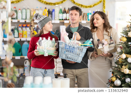 Cheerful family shopping for self-care and hygiene products in decorated store 133632940