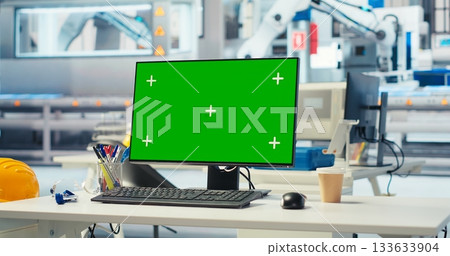 Chroma key PC in solar panels manufacturing plant used to develop new technologies harnessing sun power. Green screen computer in empty photovoltaics factory used to improve efficiency 133633904