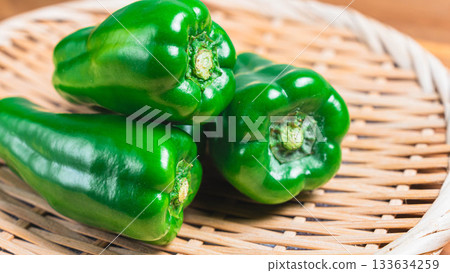 Bell peppers served on a bamboo colander 133634259