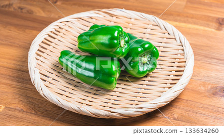 Bell peppers served on a bamboo colander Bell peppers served on a bamboo colander 133634260