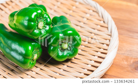 Bell peppers served on a bamboo colander Bell peppers served on a bamboo colander 133634261