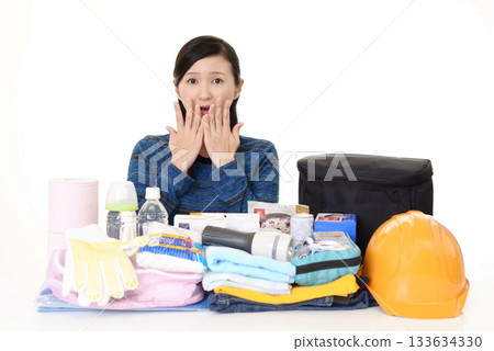A woman preparing disaster prevention supplies 133634330