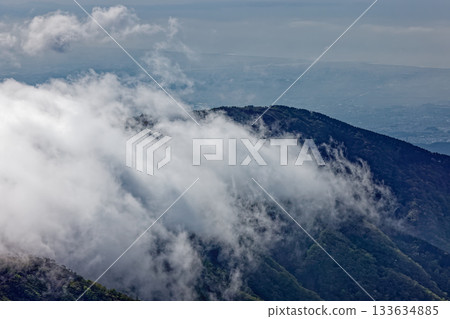 View of the waterfall and clouds hanging from Mt. Tonotake in Tanzawa and the Shonan cityscape View of the waterfall and clouds hanging from Mt. Tonotake in Tanzawa and the Shonan cityscape 133634885