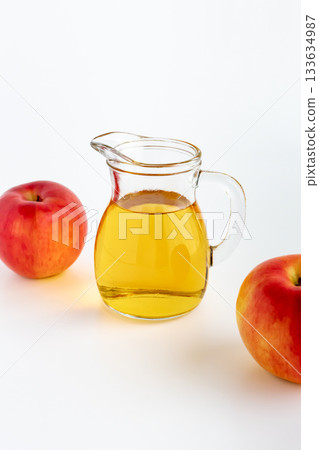 Apple cider vinegar on a white background Apple cider vinegar on a white background 133634987