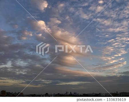 Clouds illuminated by the setting sun 133635619