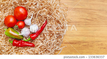 Composition of fresh vegetables on a wooden surface 133636337