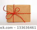 Gift in craft paper on a white background 133636461
