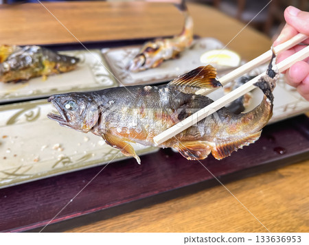 Ayu, a mountain stream fish, is a Japanese dish made by grilling it with salt. 133636953