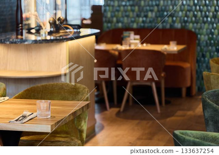 charming table setup for relaxing moments, comfortable surface with stylish seating and natural illumination charming table setup for relaxing moments, comfortable surface with stylish seating and natural illumination 133637254