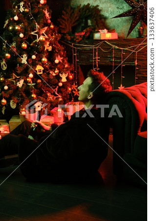 Reflections and string lights enhance cozy festive street ambiance Reflections and string lights enhance cozy festive street ambiance 133637406