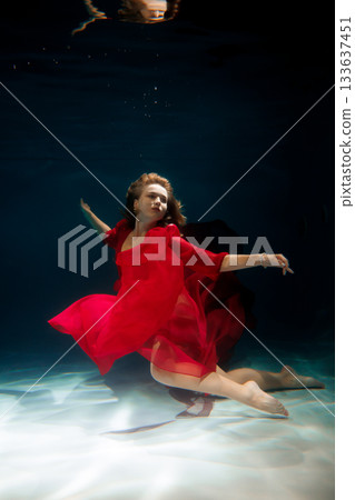 Graceful submerged ballet, Elegant mermaid in glowing 133637451